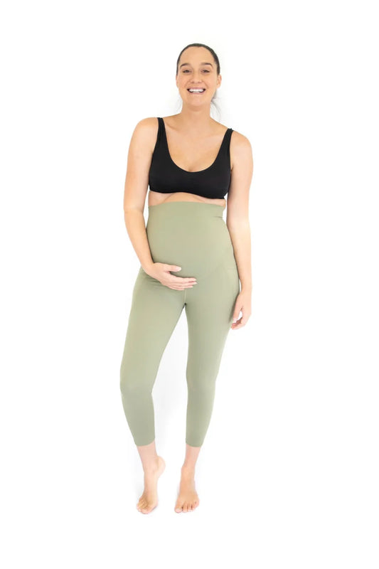 Smiling pregnant woman in emamaco maternity 7/8 Pocket Maternity Leggings - Olive