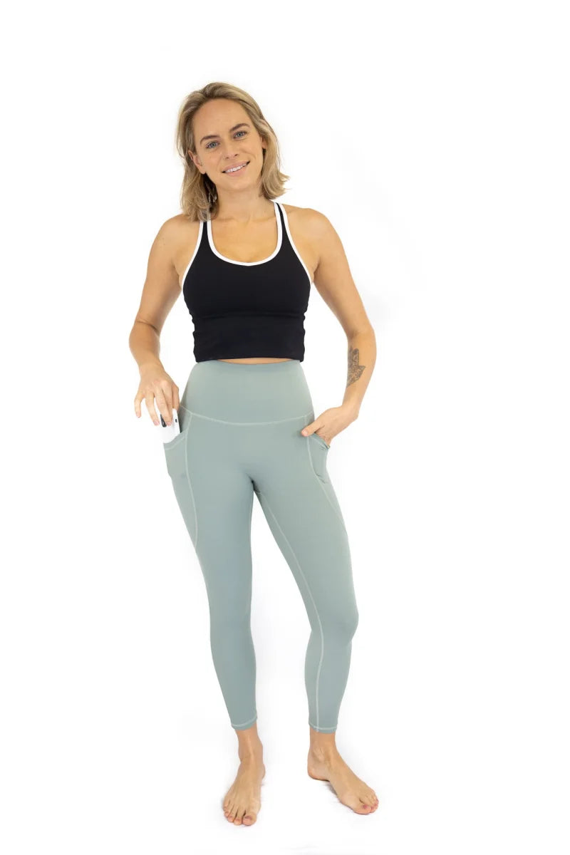 Woman in black tank top and light blue leggings from 7/8 Shaper Move, final sale