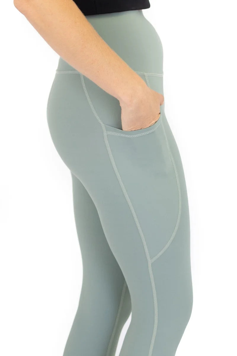 Pale green 7/8 Shaper Move Leggings with pockets on model for final sale, limited sizes