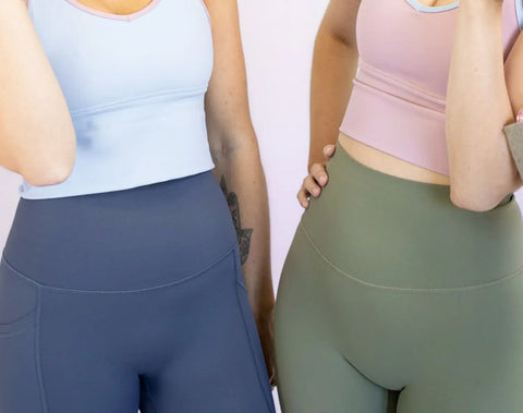 Athletic leggings in navy blue and olive green with fitted tank tops for high waist style