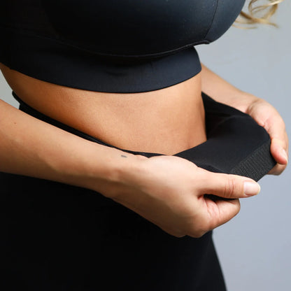 Midriff-baring black athletic outfit adjusted for introducing Emamaco Shapewear