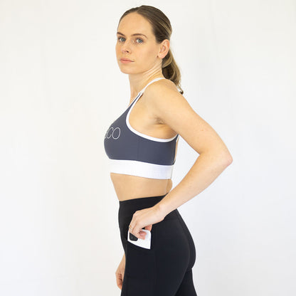 Woman modeling Elevate Nursing Sports Bra in Deep Blue athletic clothing