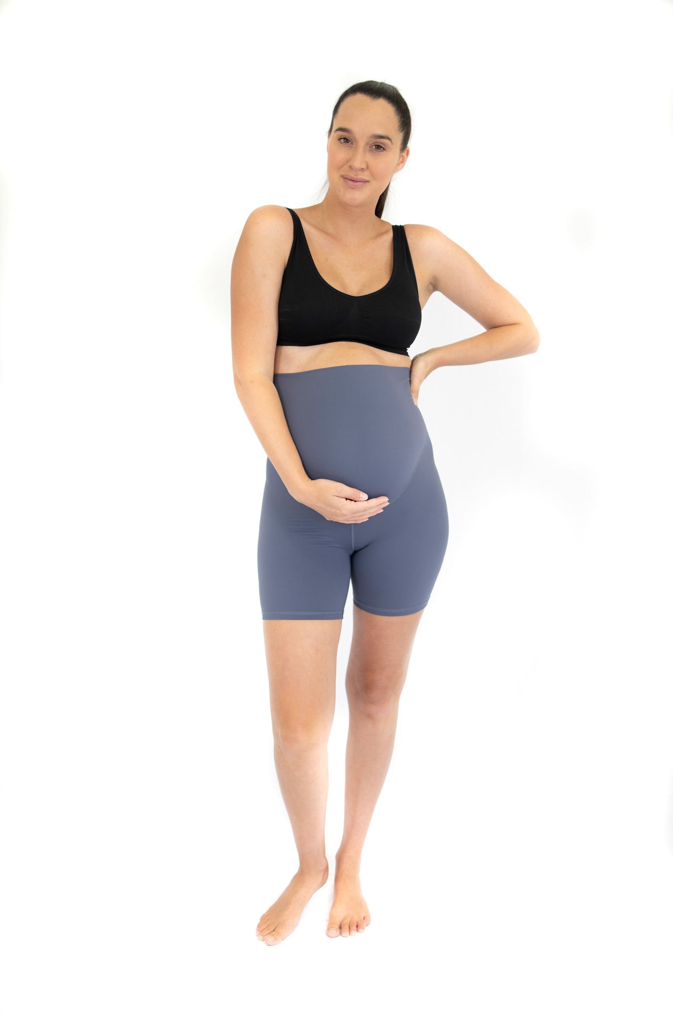 Pregnant woman in emama maternity bike shorts for comfortable, active pregnant life