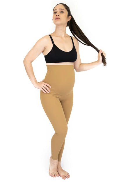 Woman in black sports bra and beige Emama Maternity Leggings, showcasing stylish comfort