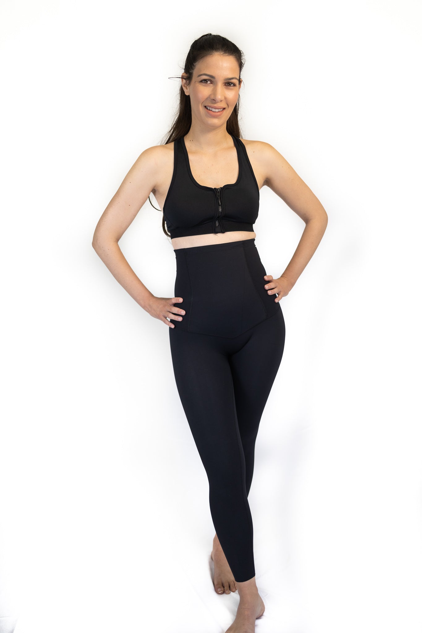 Woman in black athletic wear showcasing Pregnancy Recovery Emama Full Length Leggings