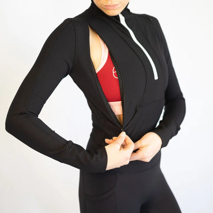 Black athletic jacket with white zipper over body hugging breastfeeding sports bra