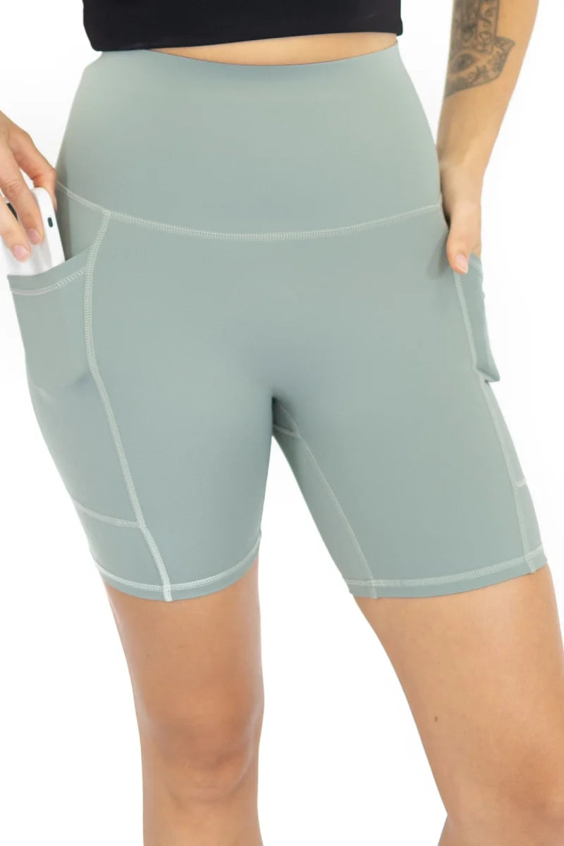 Pale blue high-waisted workout shorts with pockets, limited sizes remaining, final sale