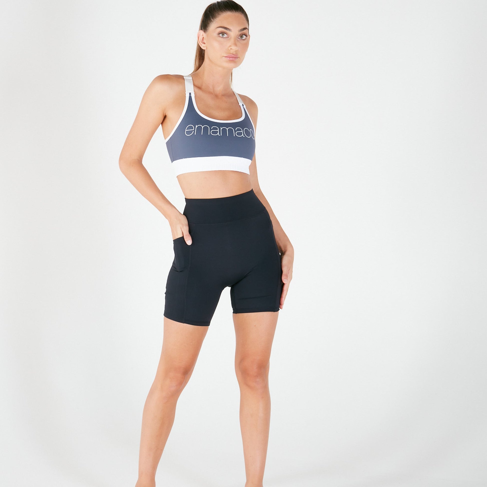 Woman in blue sports bra and black Vibe Shorts with regular fit waistband for everyday wear